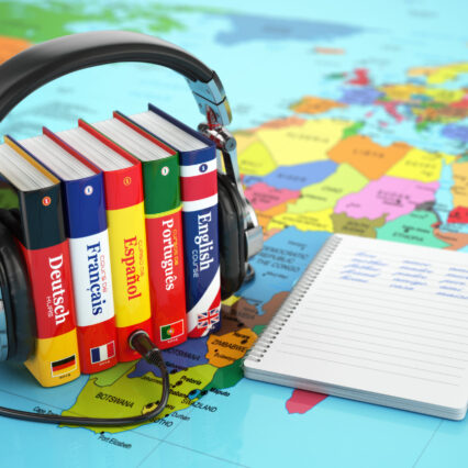 Learning,Languages,Online.,Audiobooks,Concept.,Books,And,Headphones,On,The